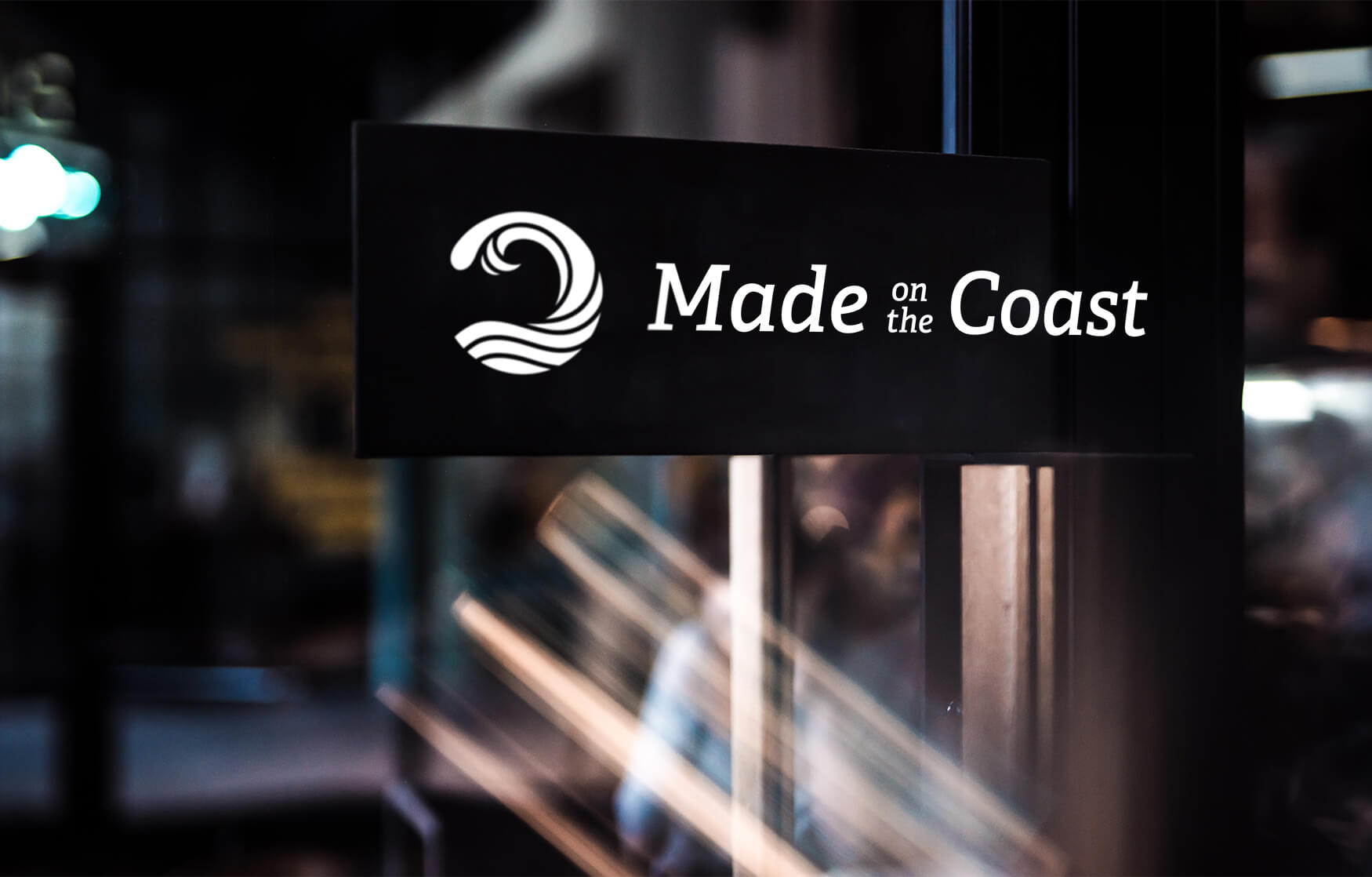 Made on the Coast logo on window sign